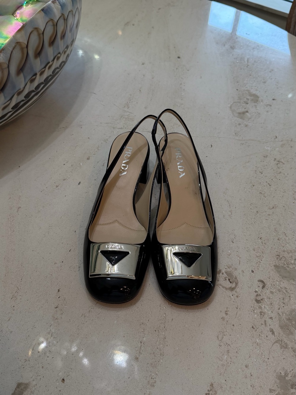 Prada Black Patent Slingback pumps with Silver Plaque Accent